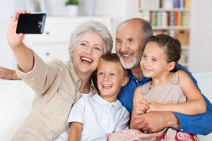 Grandparents And Grandchildren With A Camera