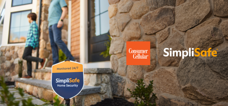 A well-lit front door with a SimpliSafe security system keypad mounted on the wall, illustrating home security for Consumer Cellular customers.