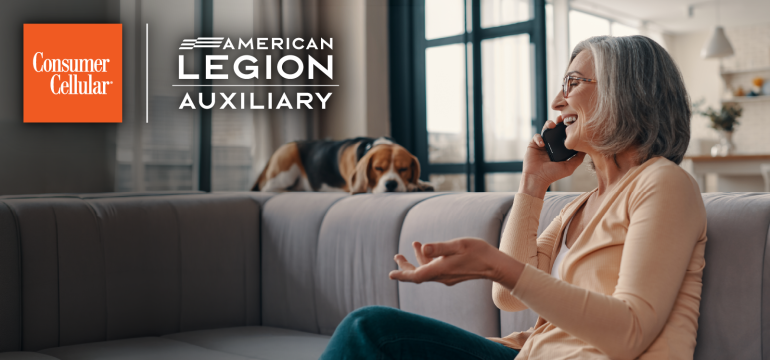 American Legion Auxiliary member holding a smartphone, with the Consumer Cellular and American Legion Auxiliary logos, promoting $25 off wireless service for ALA members with code ALA25.